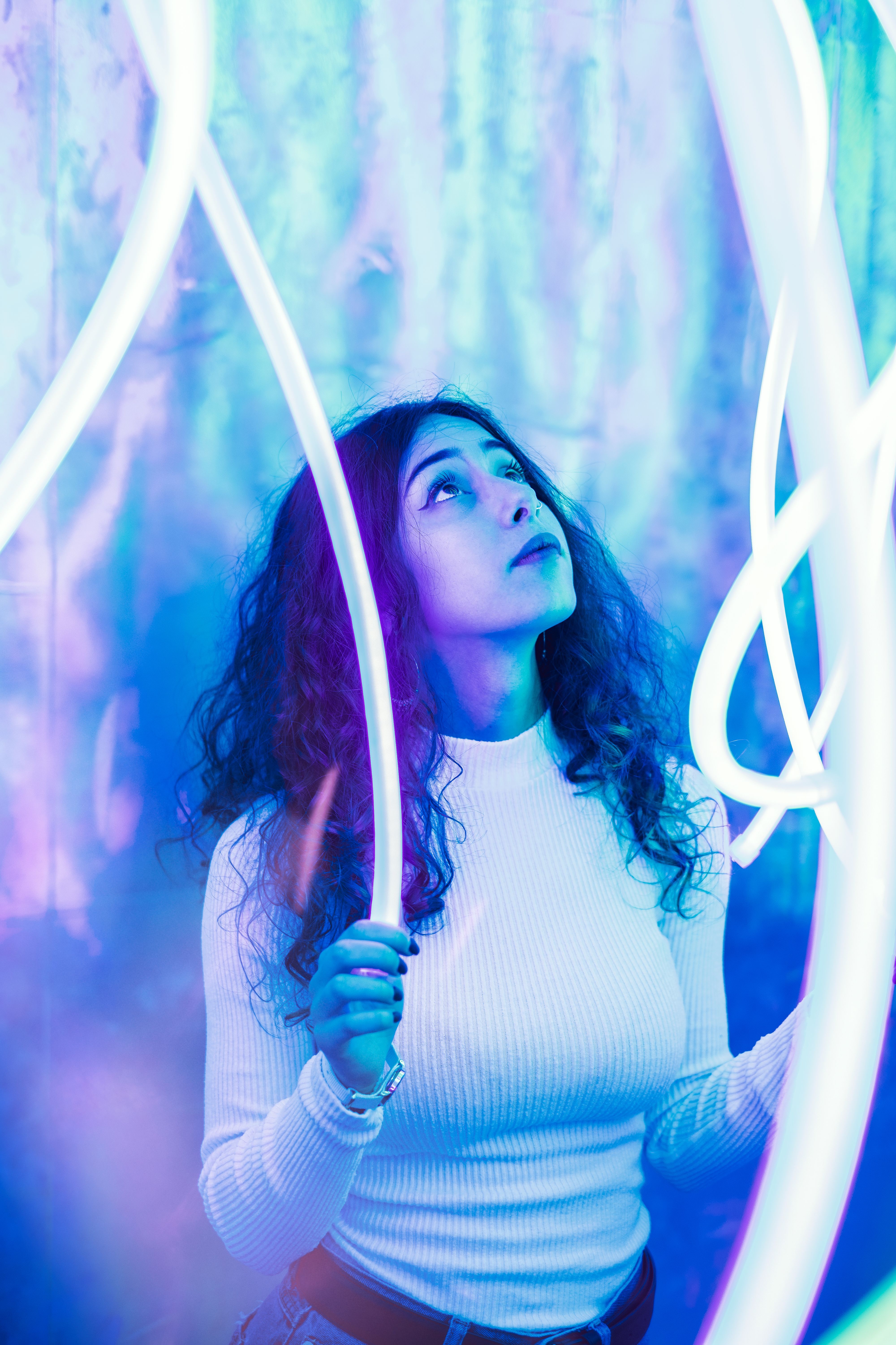 Woman in White Long Sleeve Shirt Looking Up · Free Stock Photo