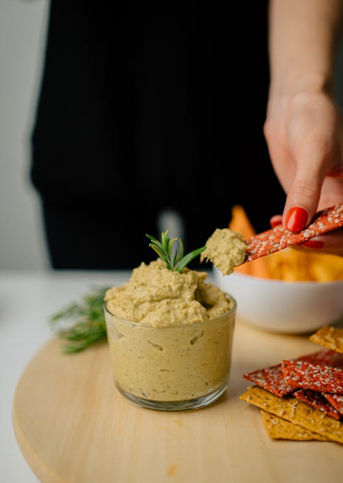 Close-up Photo of Humus on a Glass