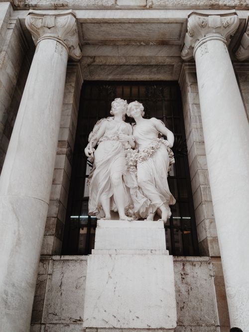 Free White marble Greek statues at Palacio de Bellas Artes in Mexico City, featuring intricate detail and neoclassical architecture. Stock Photo