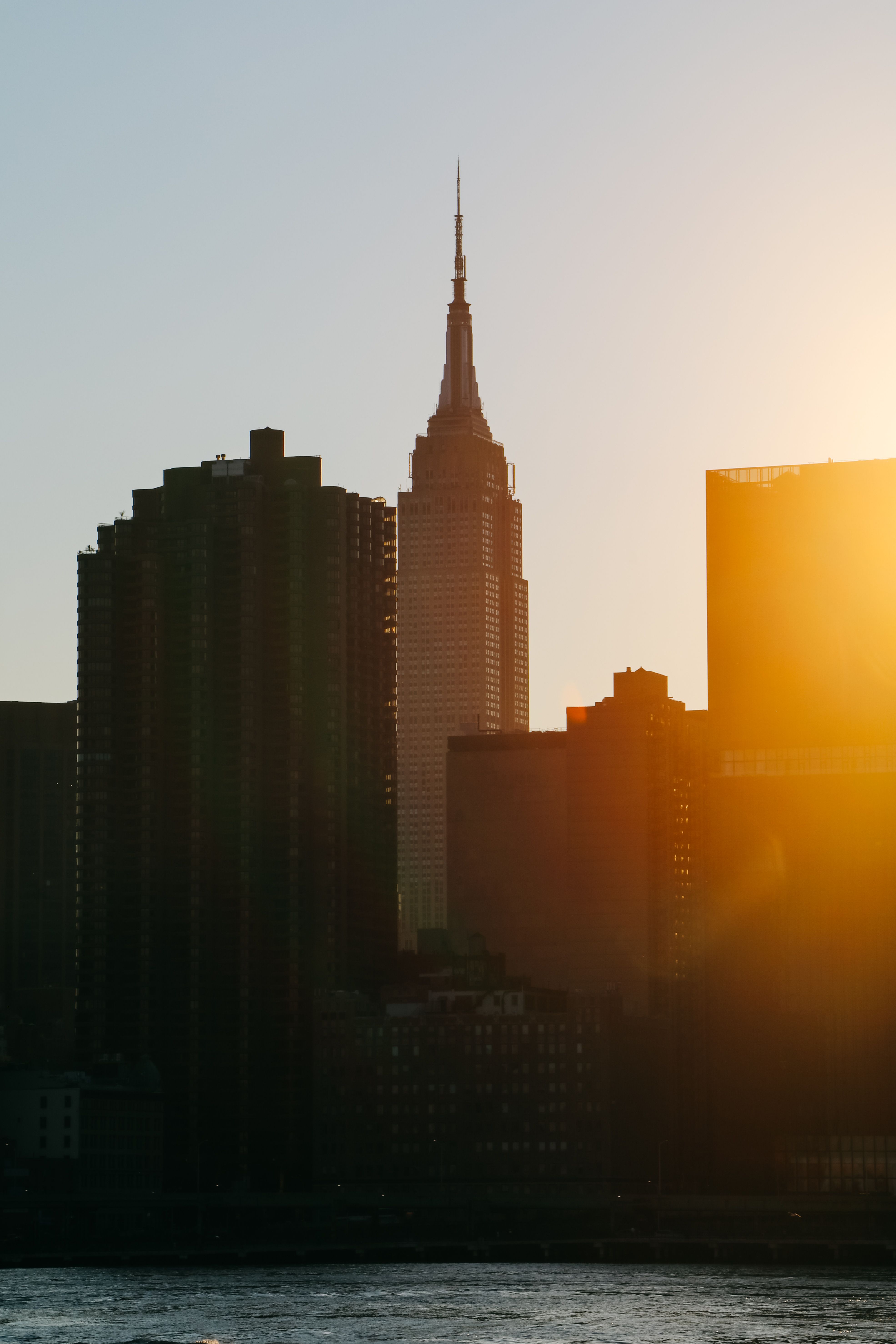Silhouette of Buildings Under Golden Hour Sky · Free Stock Photo