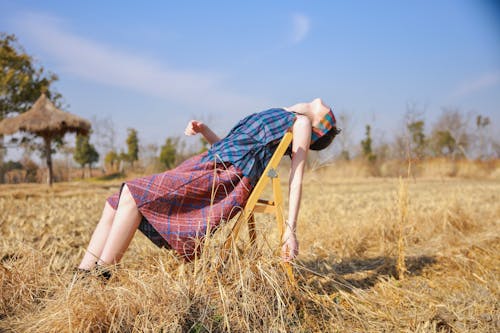 Blindfolded Girl Sitting in a Chair