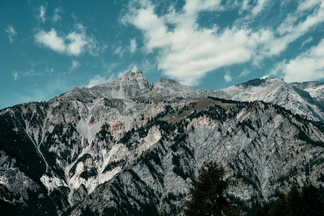 Photo of a Rocky Mountain Under a Blue Sky · Free Stock Photo