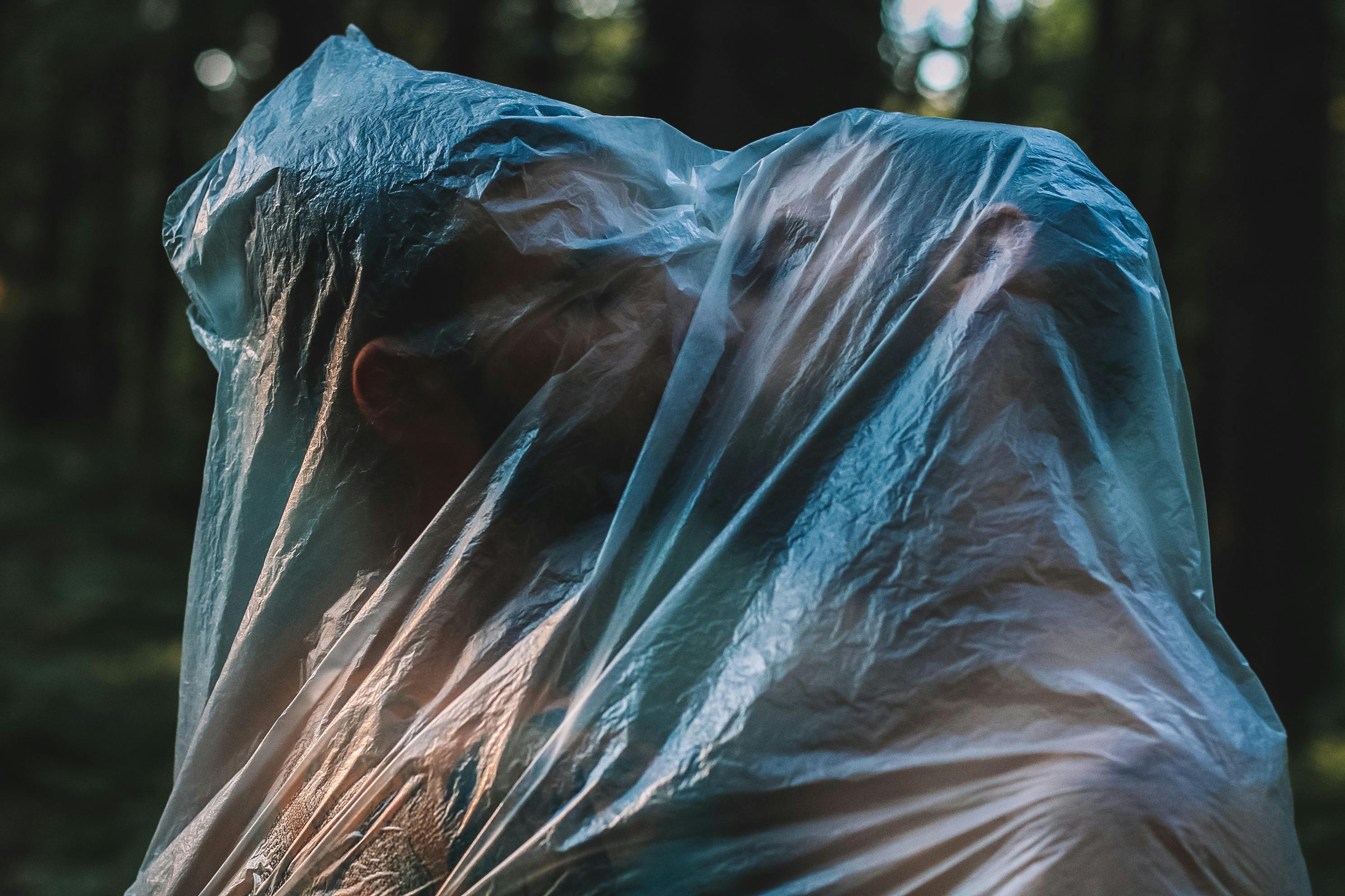 couple kissing inside clear plastic bag