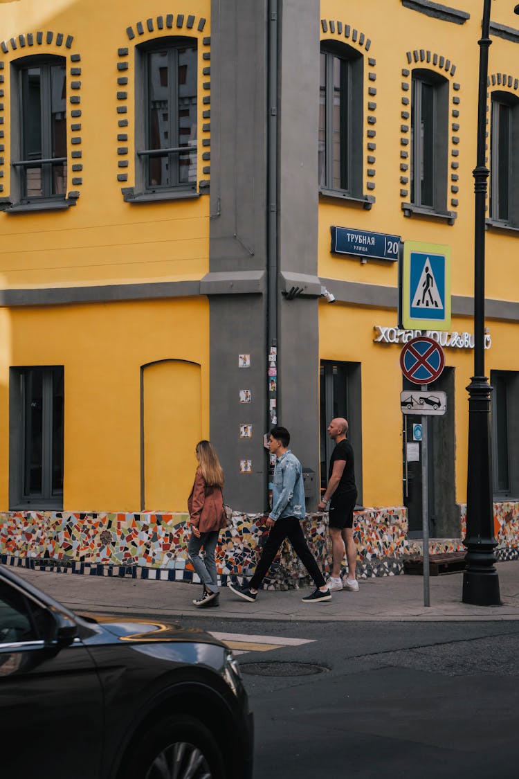 
People Walking On A Sidewalk