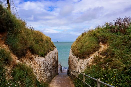 Explore the stunning pathways leading to Margate's coastal cliffs and the tranquil sea.