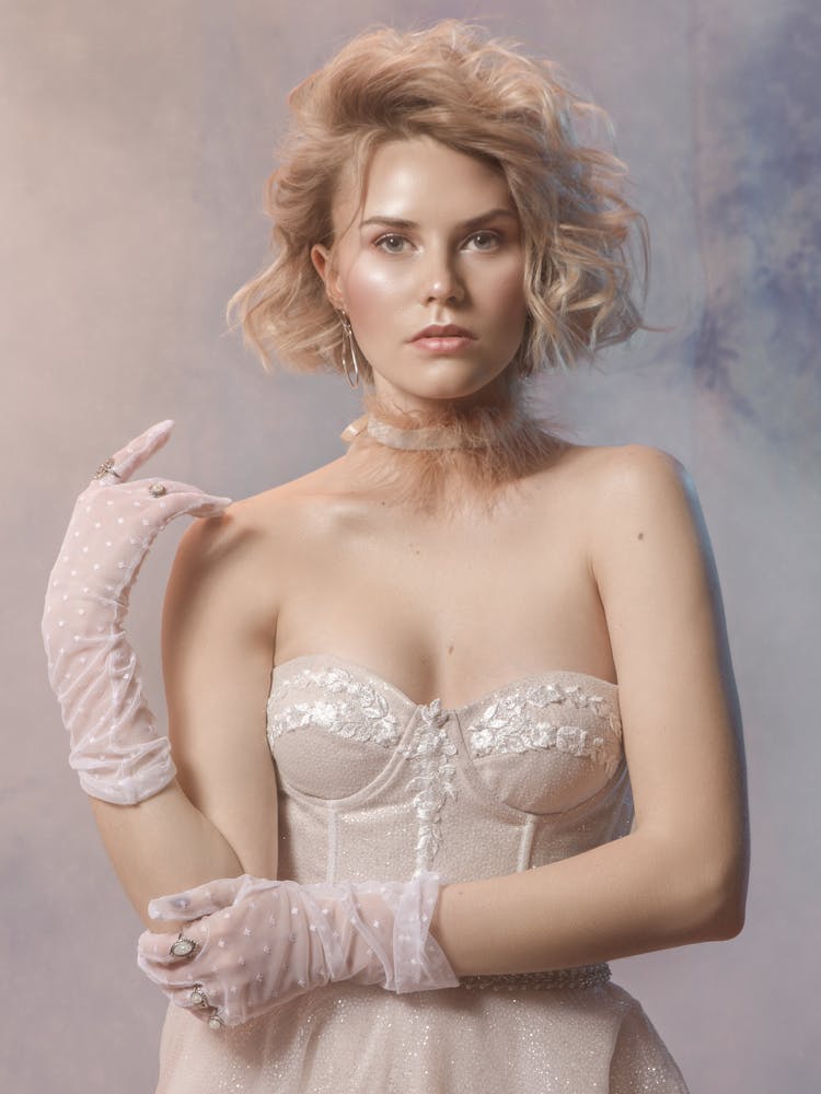 Woman Wearing Lace Brassiere And Gloves Posing