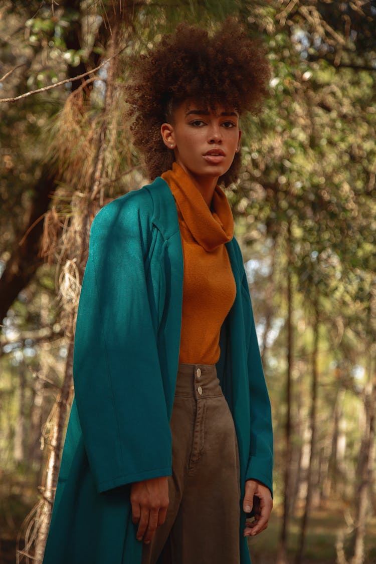 Woman Wearing Green Coat Standing Under A Tree