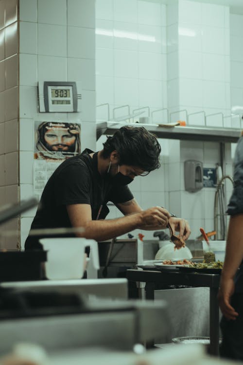 Man in Black Crew Neck T-shirt Standing in Kitchen