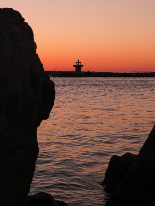 Foto profissional grátis de alvorecer, céu com cores intensas, farol