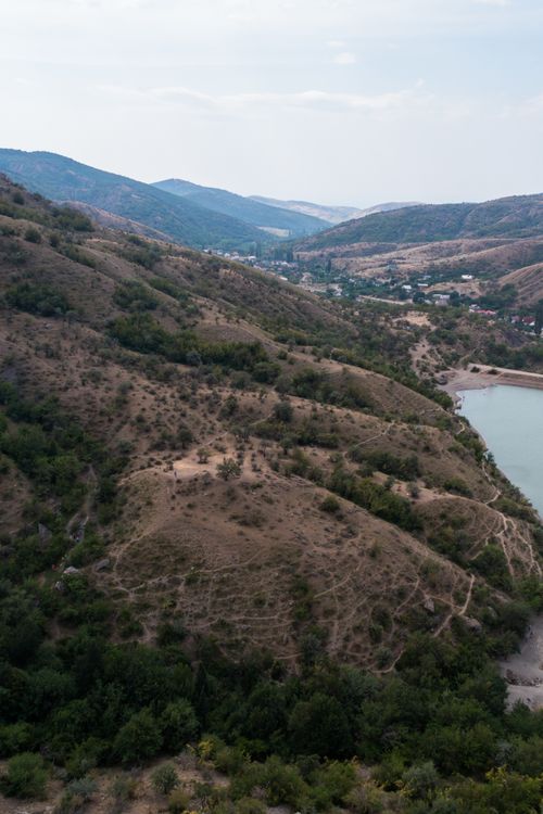 Free A stunning aerial view capturing the serene beauty of a mountainous landscape and tranquil lake. Stock Photo