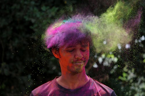 Man Wearing Pink Crew-neck Shirt With Multicolored Powder