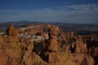 An Aerial Photography of a Rock Formations Under the Blue Sky and White Clouds