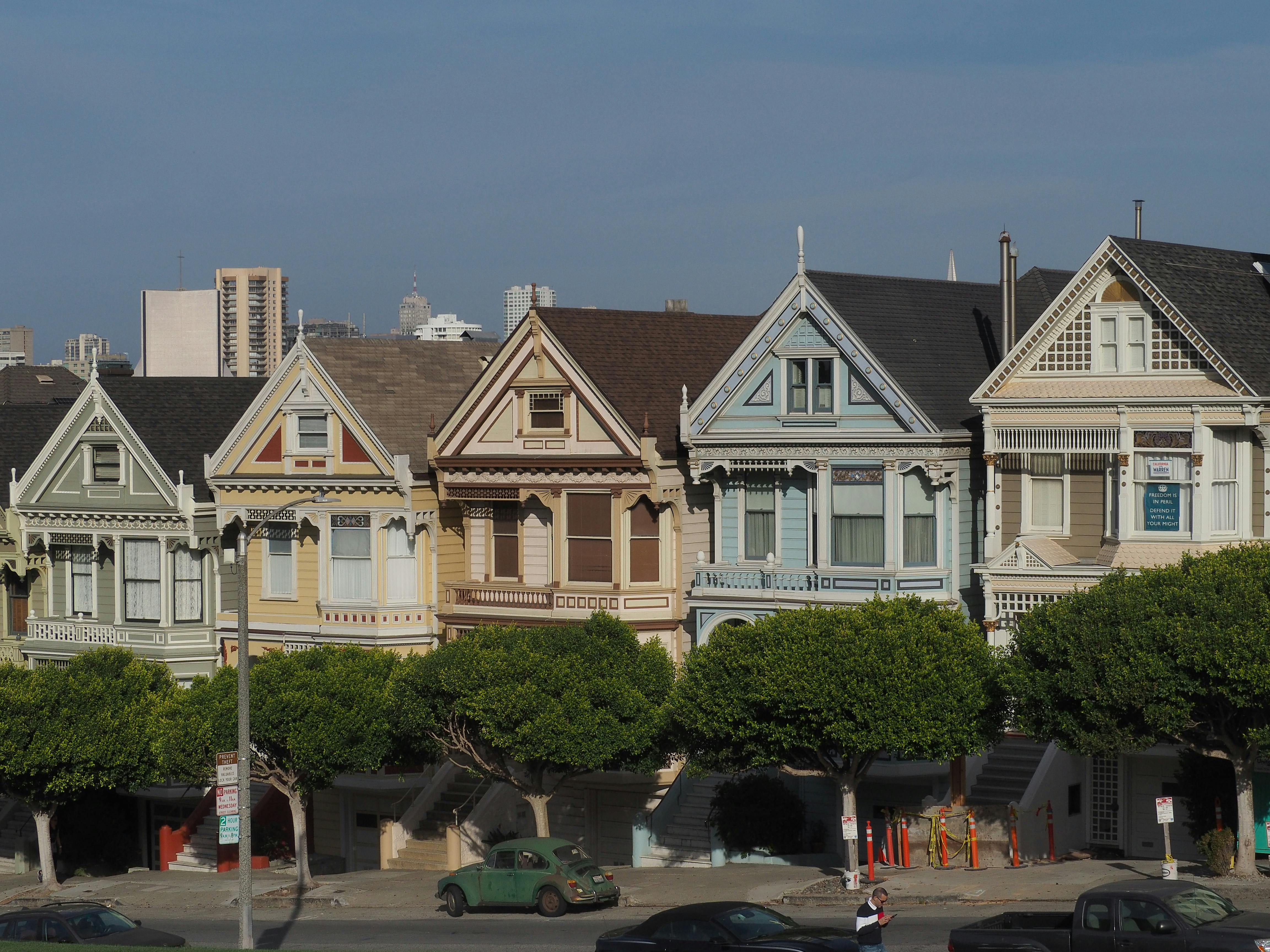 Iconic Victorian houses, the Painted Ladies, against a clear blue sky in San Francisco.