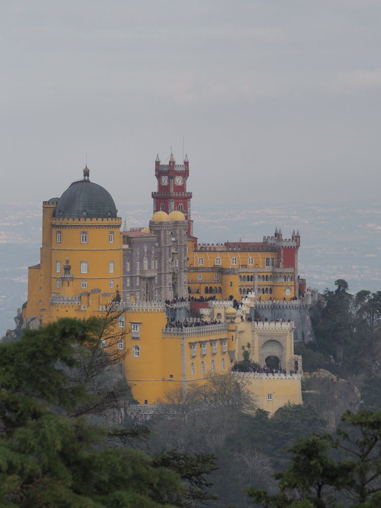 The Pena Palace In Sintra, Portugal Under Gray Sky