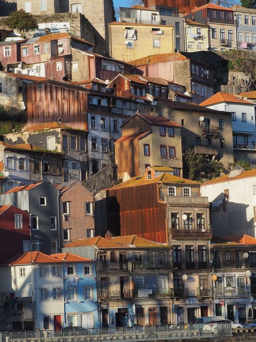 Free Charming hillside houses in Porto, Portugal, showcasing traditional architecture and vibrant colors. Stock Photo