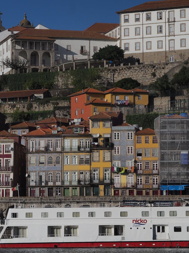 A Row Of Tall Buildings Near The Ocean