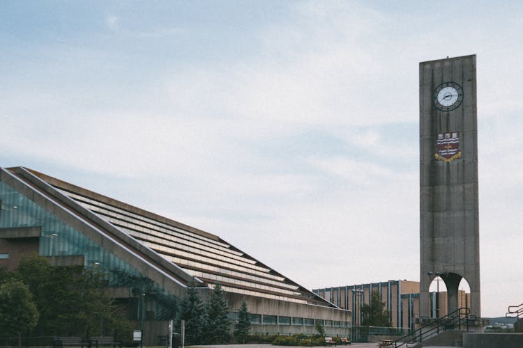 Modern Clock Tower Standing At Contemporary Business Centre