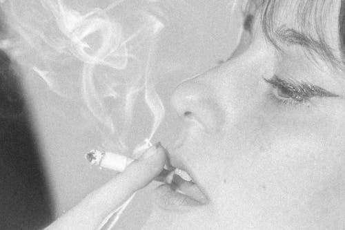 Free Grayscale Photo of Woman Smoking Cigarette Stock Photo