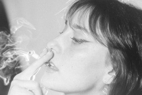 Free Grayscale Photo of a Woman Smoking Stock Photo