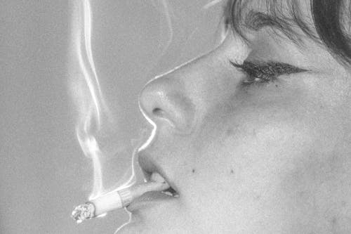 Free Grayscale Photo of Woman Smoking Cigarette Stock Photo