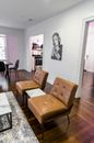 Brown Wooden Framed Beige Padded Armchair