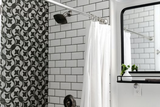 White Shower Curtain on Stainless Steel Shower Head