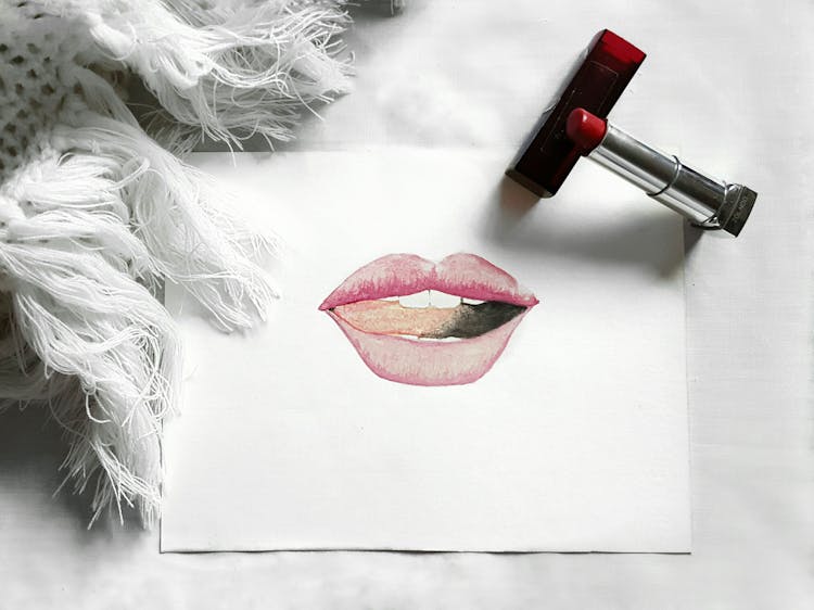 Lips Drawing And Lipstick On White Background