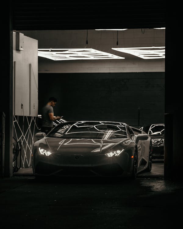 Lamborghini Aventador exiting a Garage · Free Stock Photo