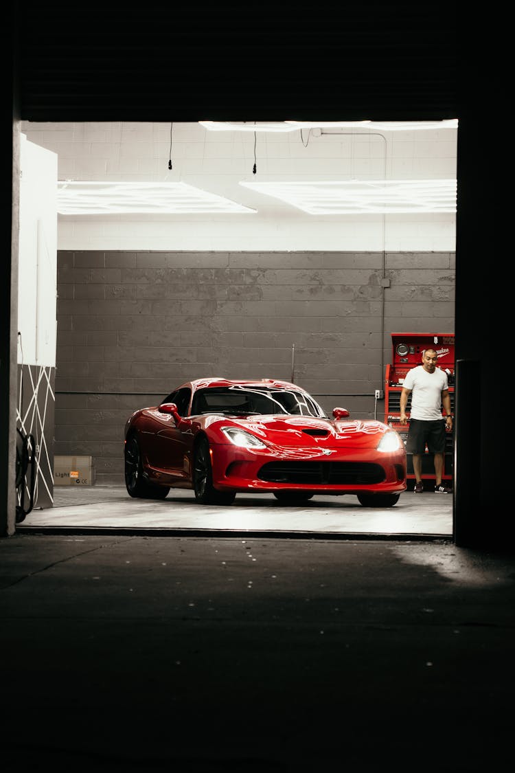 Red Ferrari 458 Italia Parked In Garage