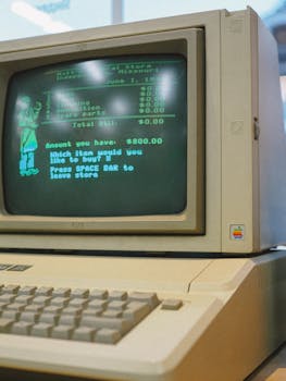 Close-up of a classic Apple II computer showcasing a retro green CRT screen, evoking nostalgia.
