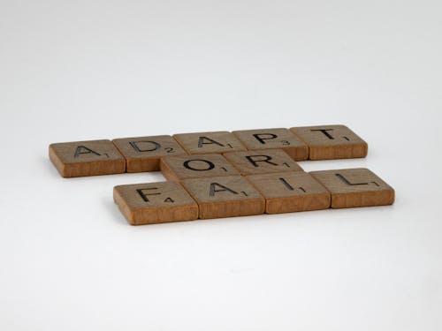 Close-up Photo of Wooden Scrabble Tiles 