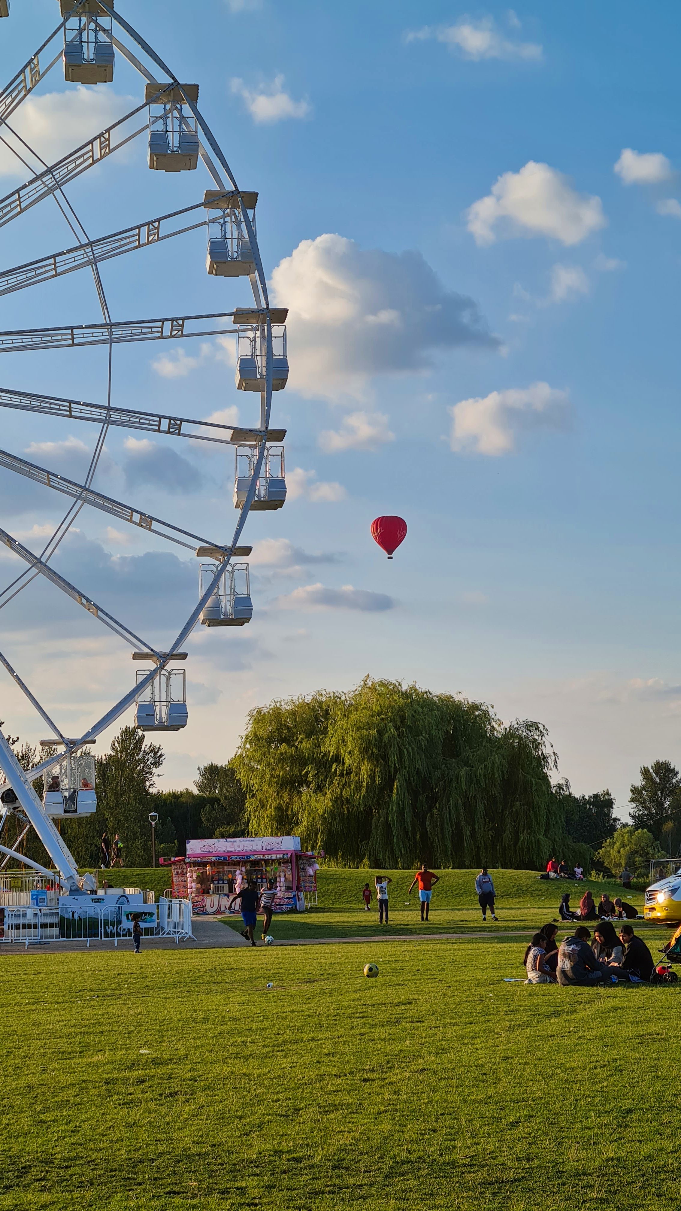 Red Hot Air Balloon Floating in the Blue Sky · Free Stock Photo