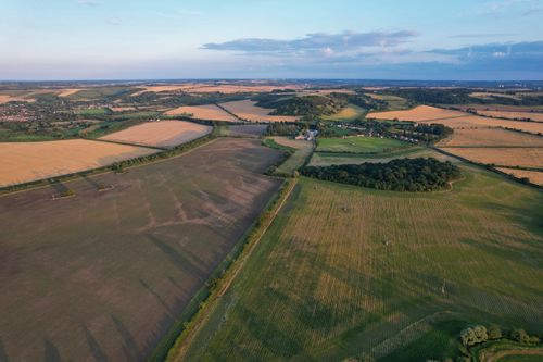 Free Stunning aerial view of expansive farmland in Central Bedfordshire, England during a sunny day. Stock Photo