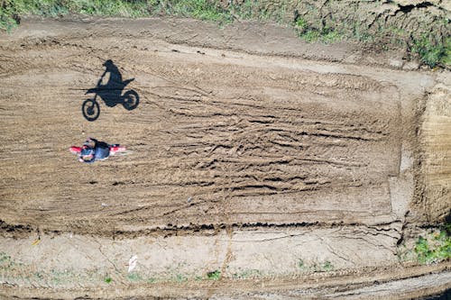 Free A Person Riding Dirt Bike on Race Track Stock Photo