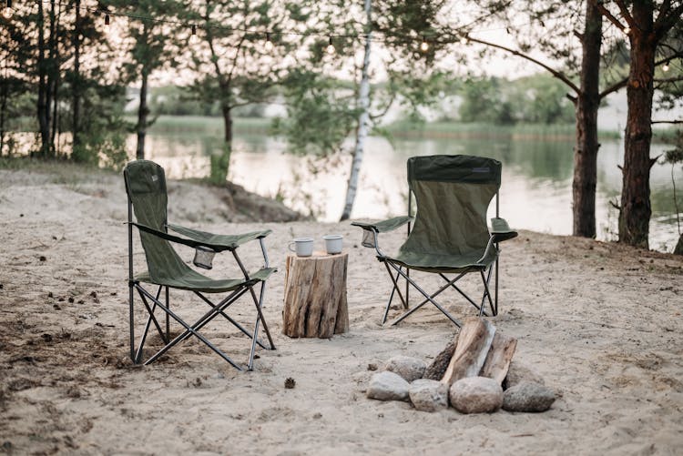 Black Camping Chairs On White Sand