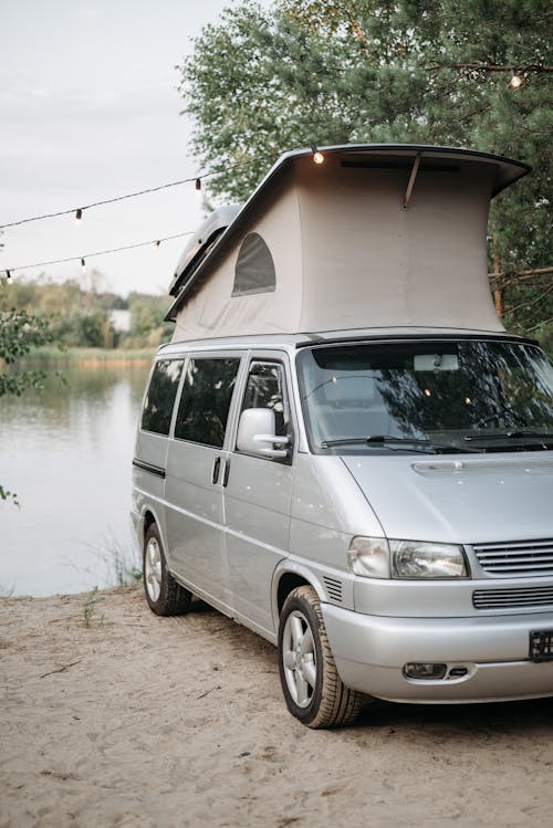 A Campervan Parked Beside the River