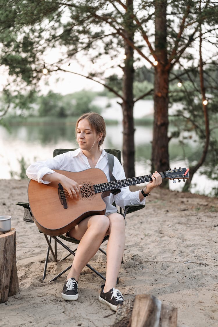 A Woman Playing Guitar