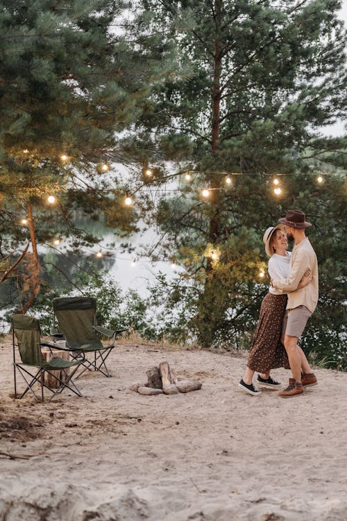 A Couple Hugging at Each Other in Forest