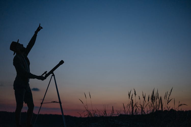 Man With Telescope Watching Sky