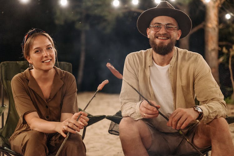 A Happy Couple Sitting Outside