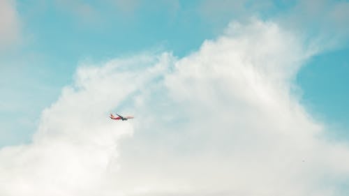 Free Airplane Flying Under Blue Sky Stock Photo