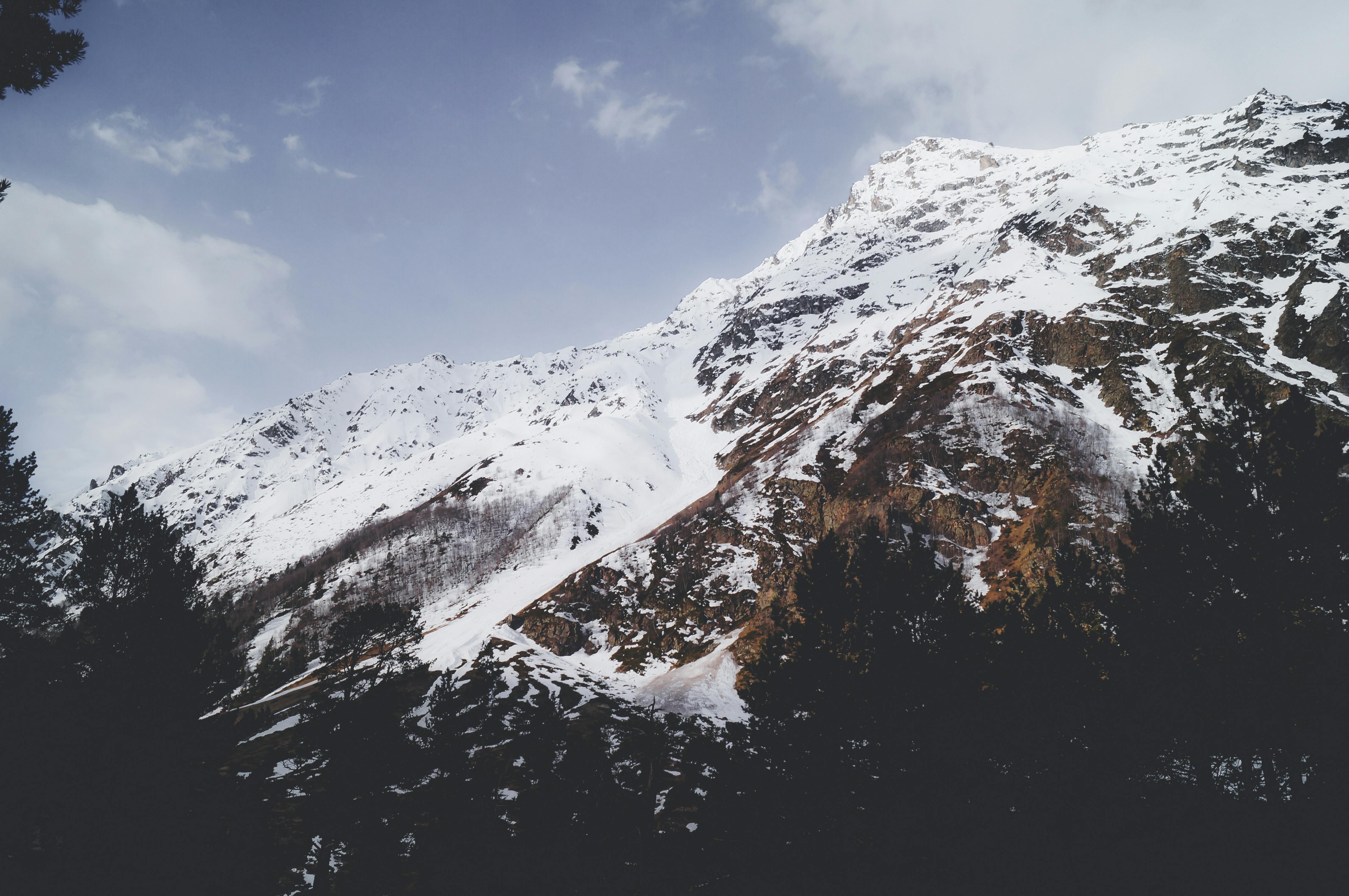 Prescription Goggle Inserts - Breathtaking view of a snow-covered mountain with a clear blue sky, capturing the essence of winter.