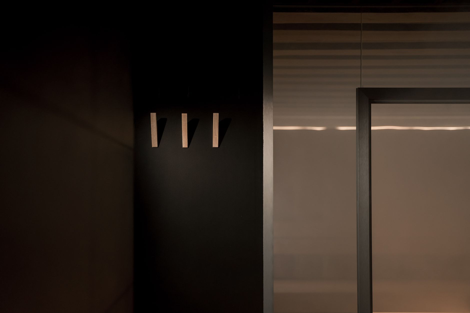 Sophisticated minimalist architectural detail in gold and charcoal tones representing the depth of strategic luxury market intelligence.