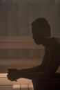 Topless Man Sitting on Floor