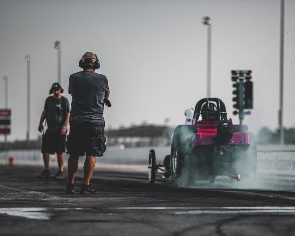 Two Men and a Racing Car · Free Stock Photo