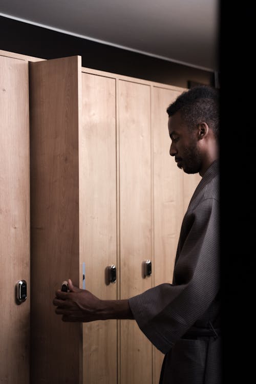 Man in Bathrobe by Locker