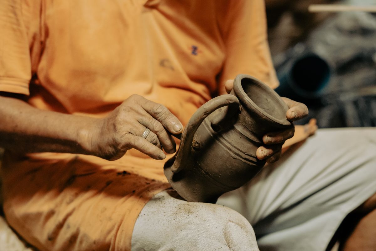 Artisan crafting pottery
