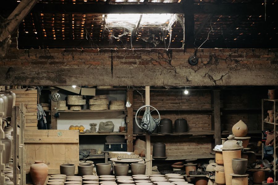 Artisan pottery studio filled with earthenware and clay pots — photo by RAVI LAGES on Pexels