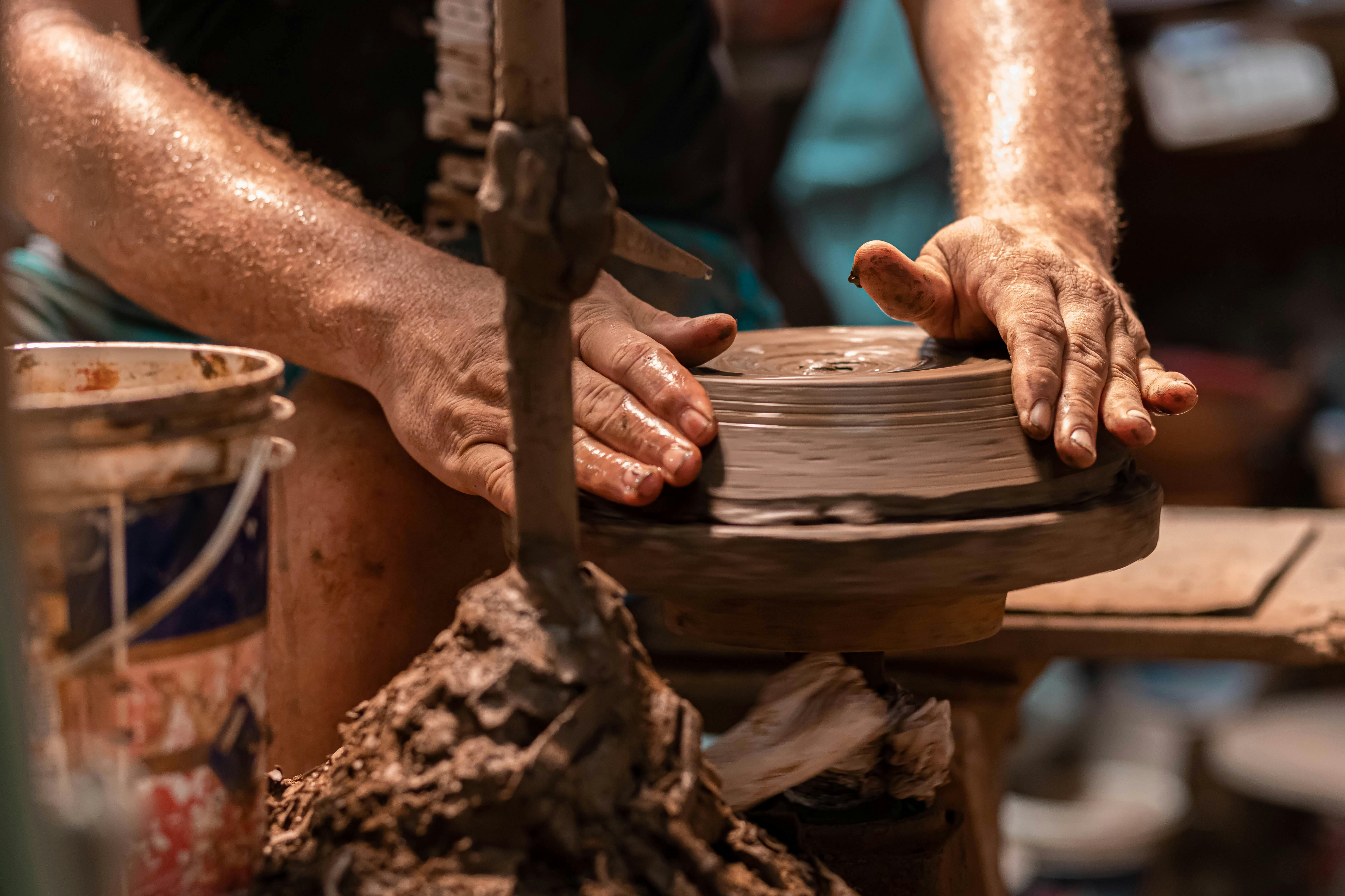 Close-Up Shot of a Person Molding Clay · Free Stock Photo