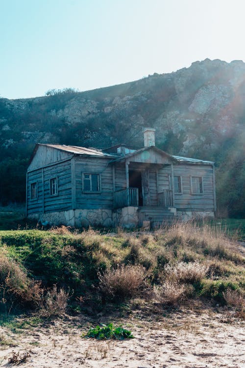 Brown Wooden House on Green Grass Field